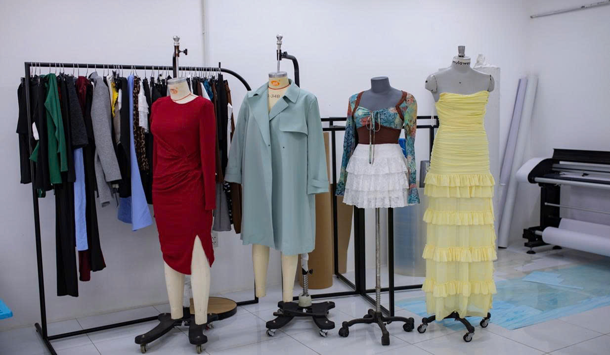 Dresses and outerwear on mannequins